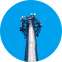 Cell tower against blue sky.